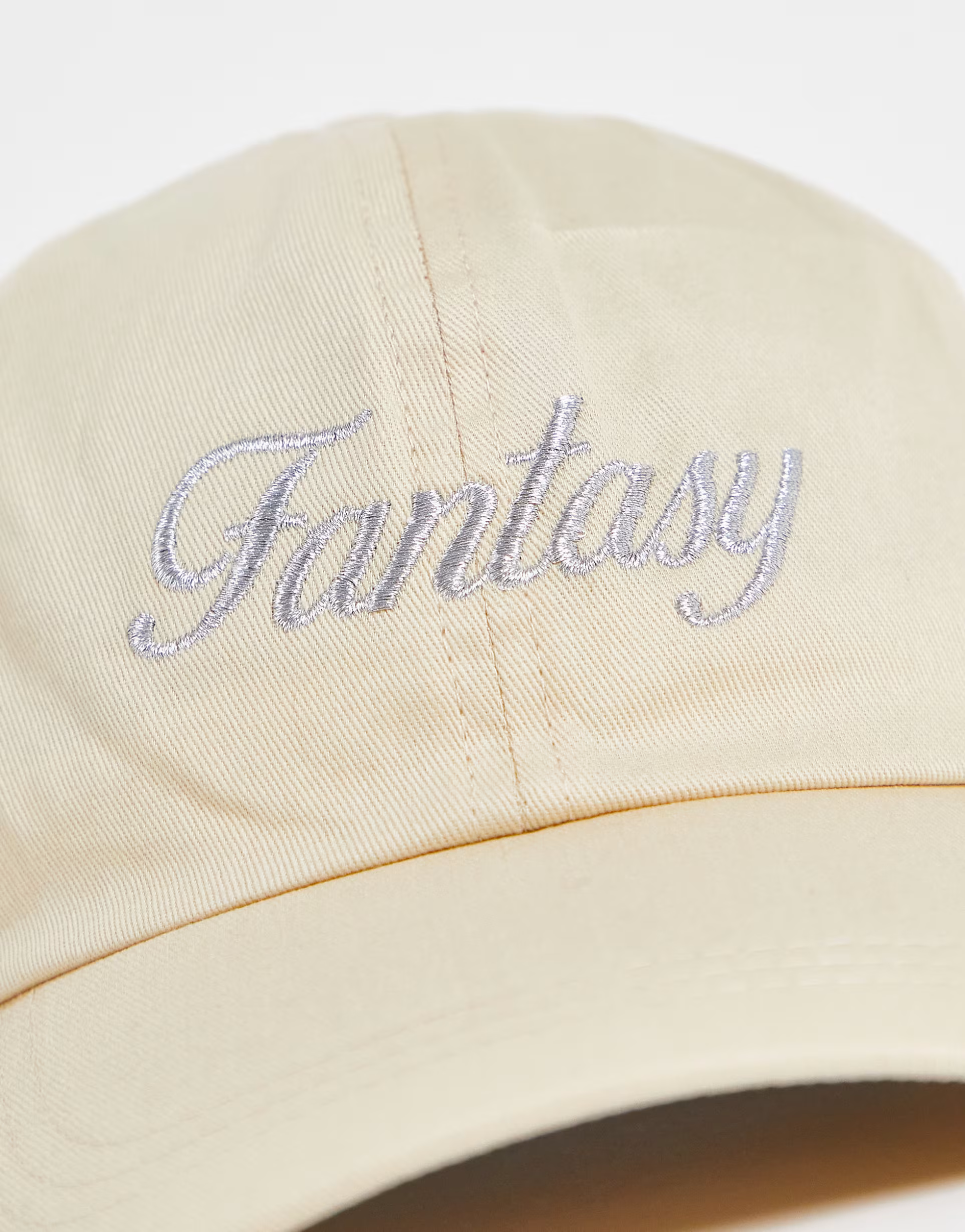 New Girl Order embroidered cap with fantasy spellout in beige