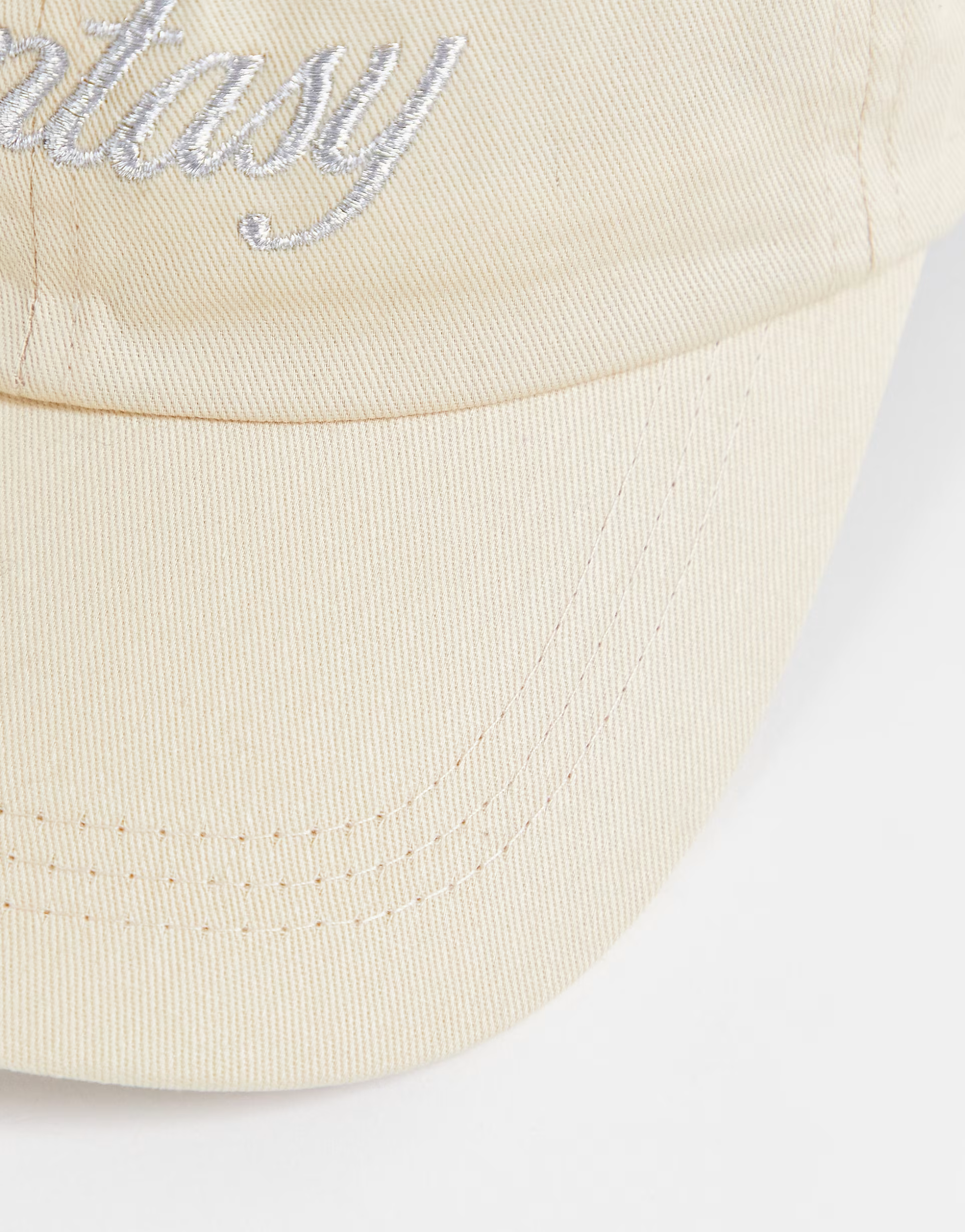 New Girl Order embroidered cap with fantasy spellout in beige