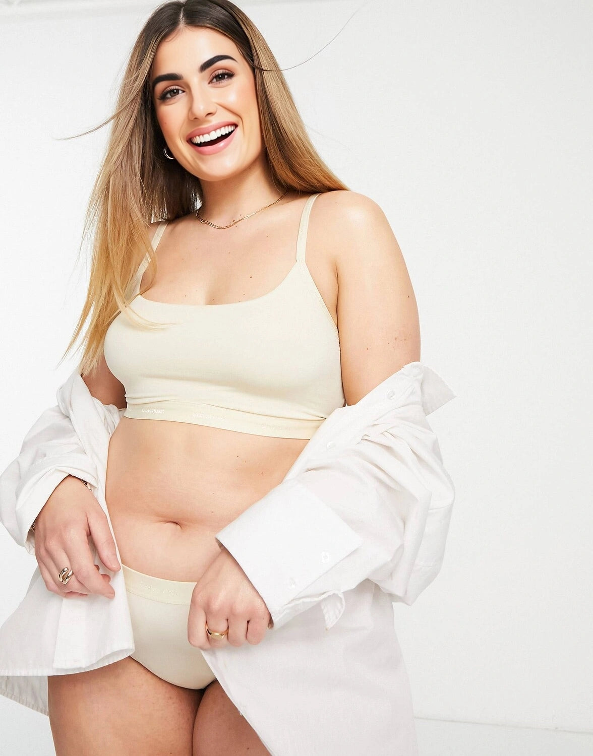Calvin Klein Plus Size Form To Body Unlined Bralette Bra With Tonal Logo in Stone