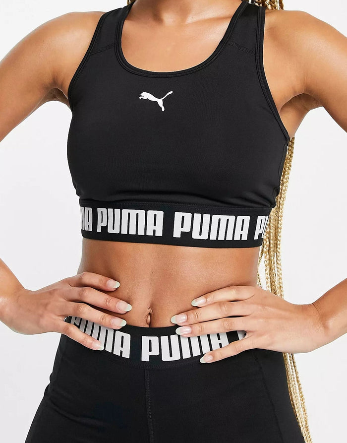 Puma Training logo mid support sports bra in thyme with gray logo exclusive  to ASOS